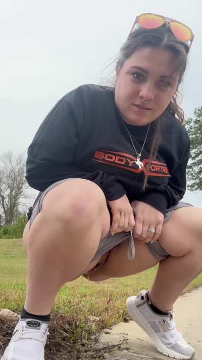 Hiding behind a building. 