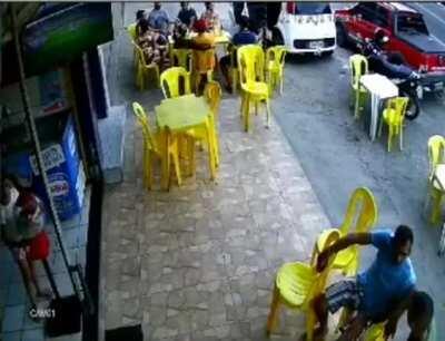 Car hits people sitting outside at a restaurant