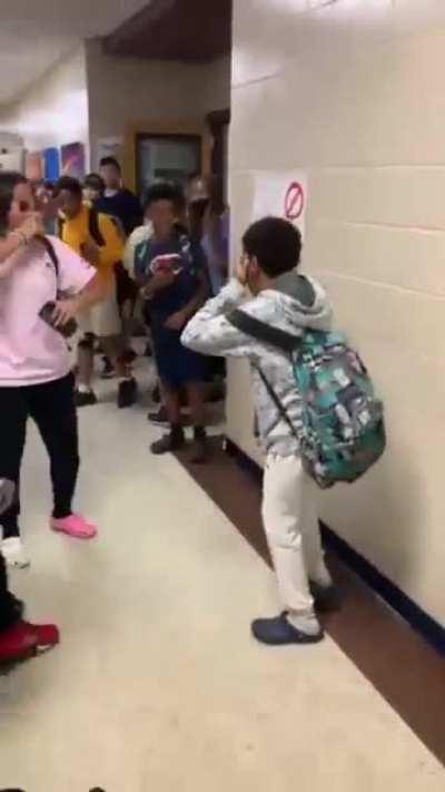 Kid in grey stepped on the guys new shoes then slapped him then gets knocked