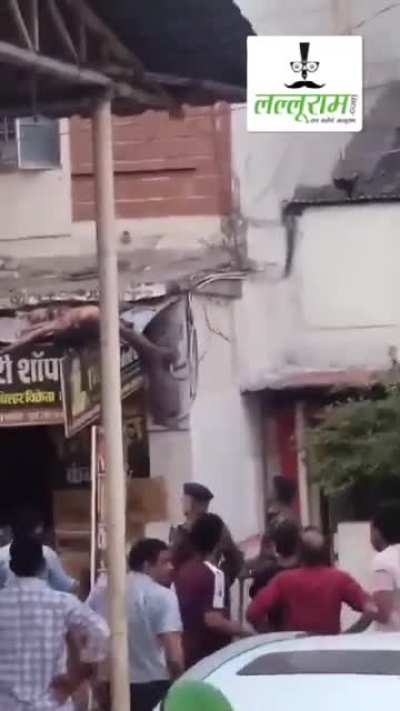 Man jumps from 3rd floor, gets entangled in electric wires, fall and then miraculously gets up to throw brick at police