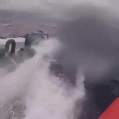 Coast guard member jumps onto drug smuggling submarine forcing surrender.