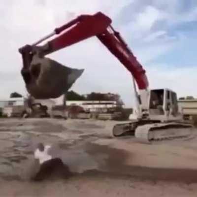 Guy Getting Hit on The Head With an Excavator Trying to do The Ice Bucket Challenge
