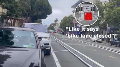 Lady flips out at guy on bike following the rules