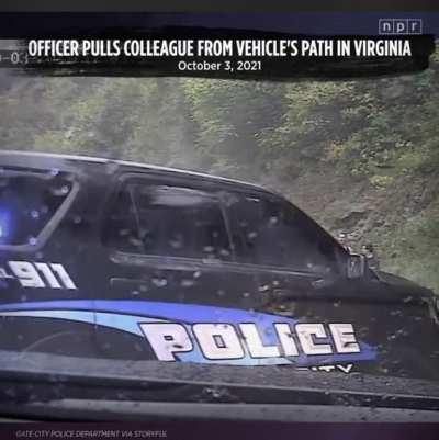 Hydroplaning car almost hulk smashes officers and pedestrians.