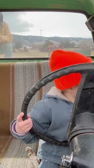 Father's Co-Pilot: Daughter Driving with Dad's Guidance on the Farm!