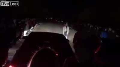 Watching a street race.