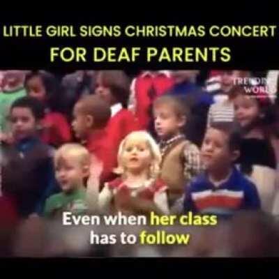 5-year-old girl signs Christmas concert for her deaf parents.