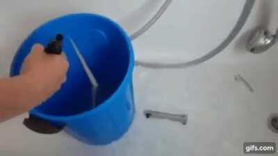 Firing a handgun in a bucket of water indoors