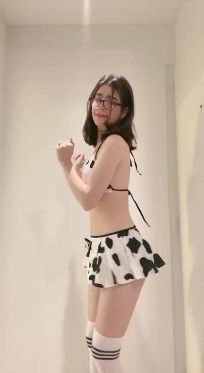 Slut shakes her ass in a cow suit