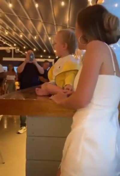 A bunch of random people making a baby's day better