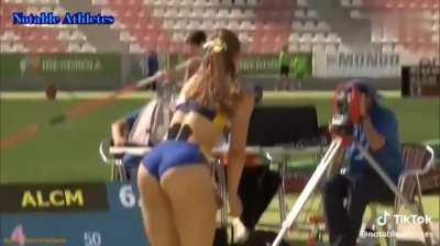A young girls reaction to beating her long jump record, and her parents are super proud in the crowd!