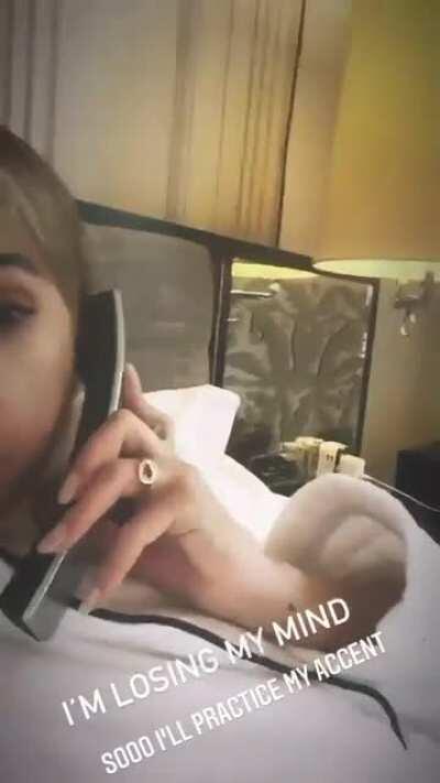 Practicing her accent