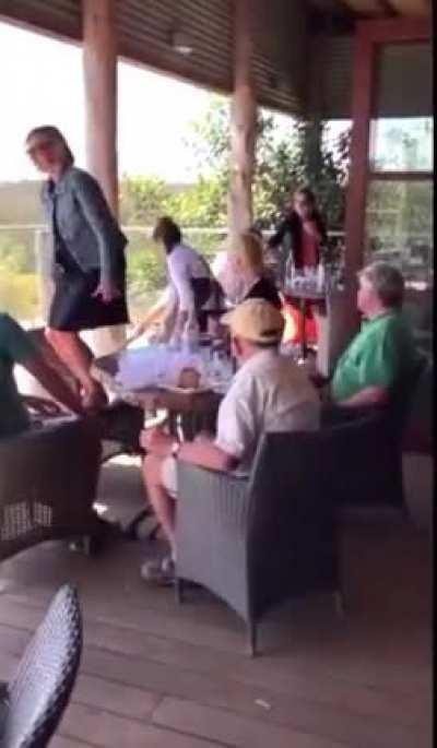 Waitress evicting an unwelcome guest from an Australian restaurant.