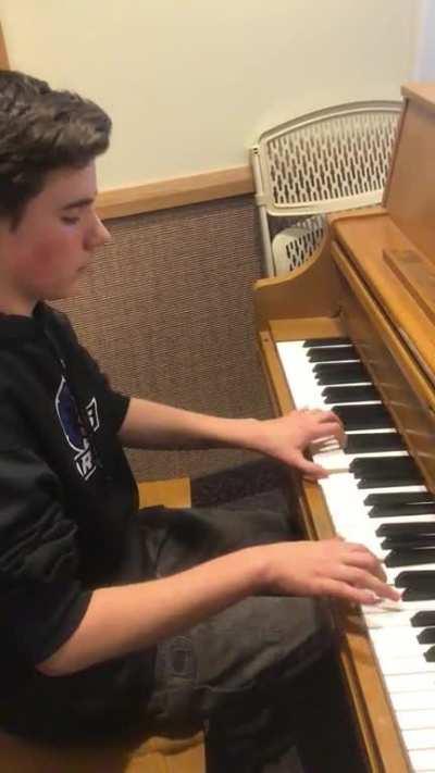 My teenage friend playing piano