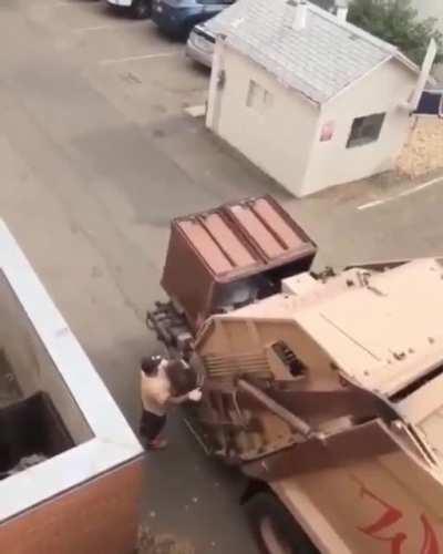 007 trash panda escapes garbage truck