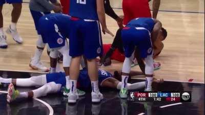 [highlight] Paul George takes a break on the floor to make snow angels