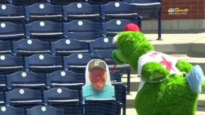 Phillie Phanatic has no patience for Marlins fan cutout.
