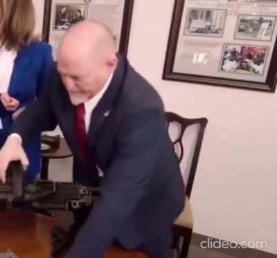 ATF agent demonstrating how to disassemble a Glock: