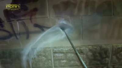 Powerwashing off graffiti in Toronto