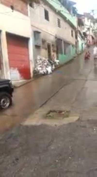 sliding down a hill during heavy rain