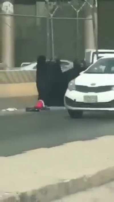 Womens in Burka busy with each other, Child thinks 