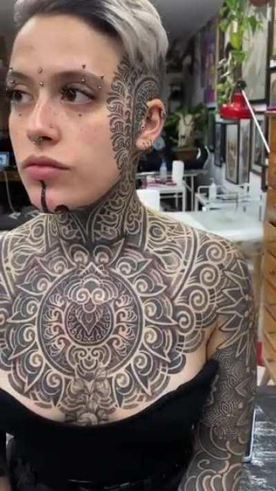 This incrdible, hypnotic body/neck/face tattoo...
