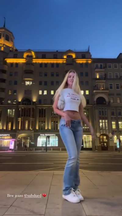 Polina Malinovskaya - Modeling in Blue Jeans Pants and White T-Shirt in Front of Busy Road (IG Story Clip)