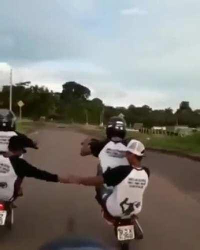 Holding hands and doing wheelie