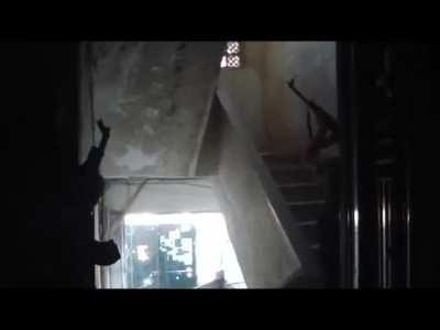 Tensions build as Al-Tawhid Brigade fighters use rifles and grenades in an attempt to clear the top of a stairwell while pushing into an SAA occupied building - Aleppo - 8/24/2012