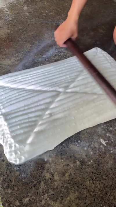 Manually pressing rubber into sheet