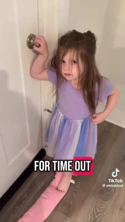 Big sister disciplining her little brother