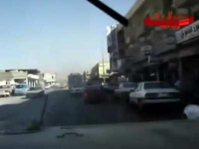 Americans driving a convoy in Iraq.