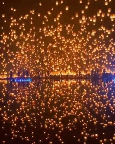 Thousands of lanterns launched into the night sky