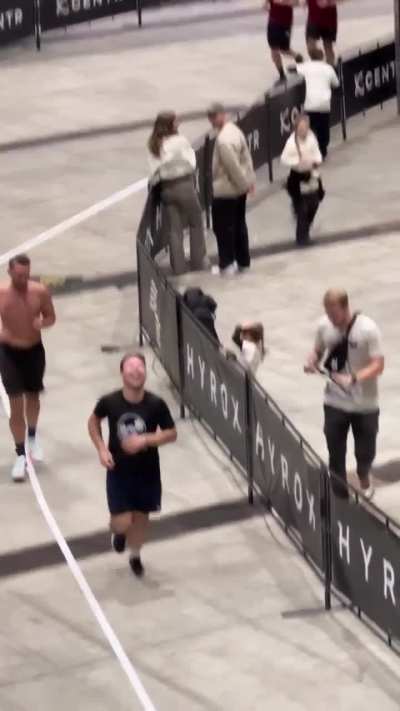 Girl trying to high five runner