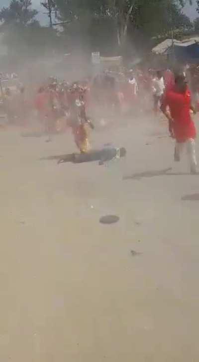 This car driving through a crowd of people