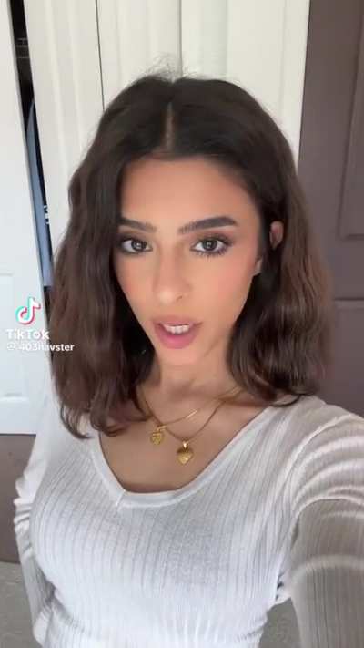 Navster in a white vest