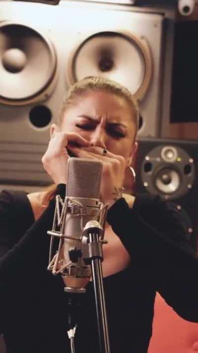 Indiara Sfair playing harmonica