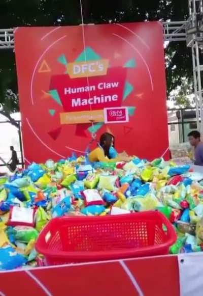 Human claw machine for snacks