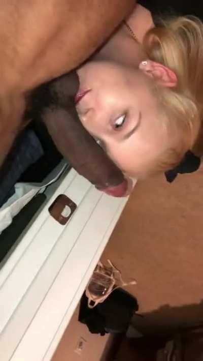Blonde down on her knees swallowing black guy