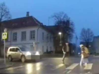 WCGW getting out of the drivers seat to help elderly lady cross the street