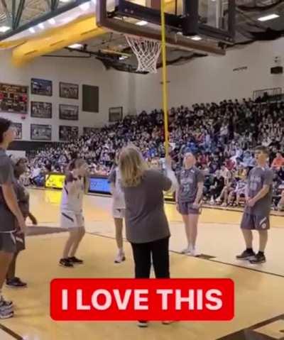 Crowd stays silent so Jules Hoogland, who is blind, can hear where to throw. She definitely heard the cheers.