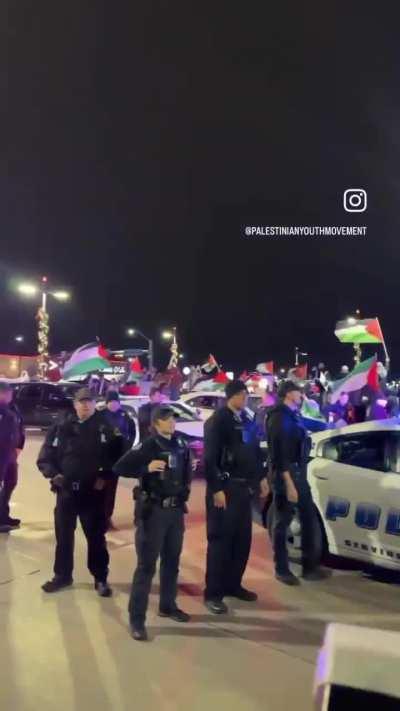 On Monday evening, as protesters gathered at the front of Dallas Love Field airport to show an unabated greeting to genocide-supporting Joe Biden, 13 brave heroes, including a PYM member and former intern of the late Eddie Bernice Johnson, put their bodie