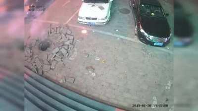 Kid Tosses Firework in manhole.