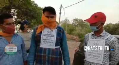 Unvaccinated forced to wear signs by Indian police