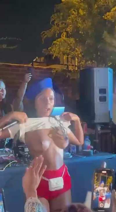 Janelle Monae flashing at concert