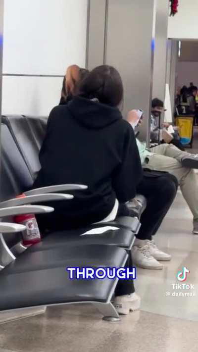 Women freaks out on boyfriend at airport