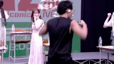 Super fitness trainer Ryota Suzuki demonstrates how to flex muscles (while Aoi Koga loses her shit and mess around in the background)