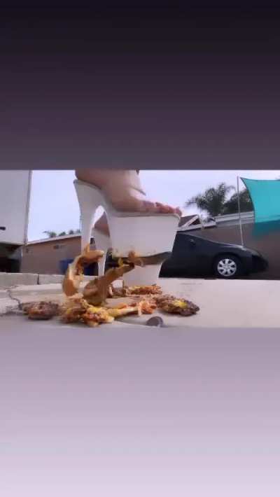 Marisa crushes burger with white platforms