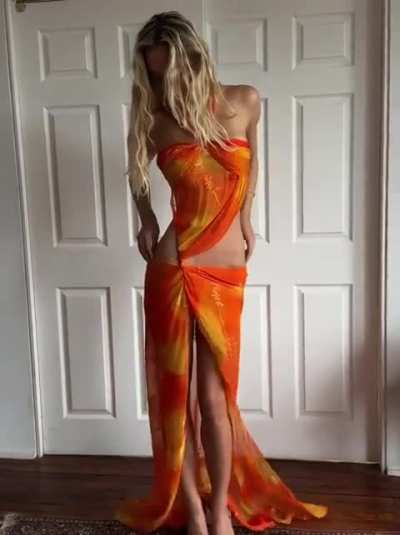 Alexis in orange dress - IG December 2025