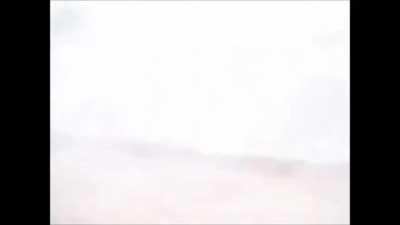 Footage from the inside of a Humvee under fire from insurgents during Iraqi insurgency. As the Humvee rounds the corner you can see the insurgents under fire. Likely during the early stages of the insurgency.